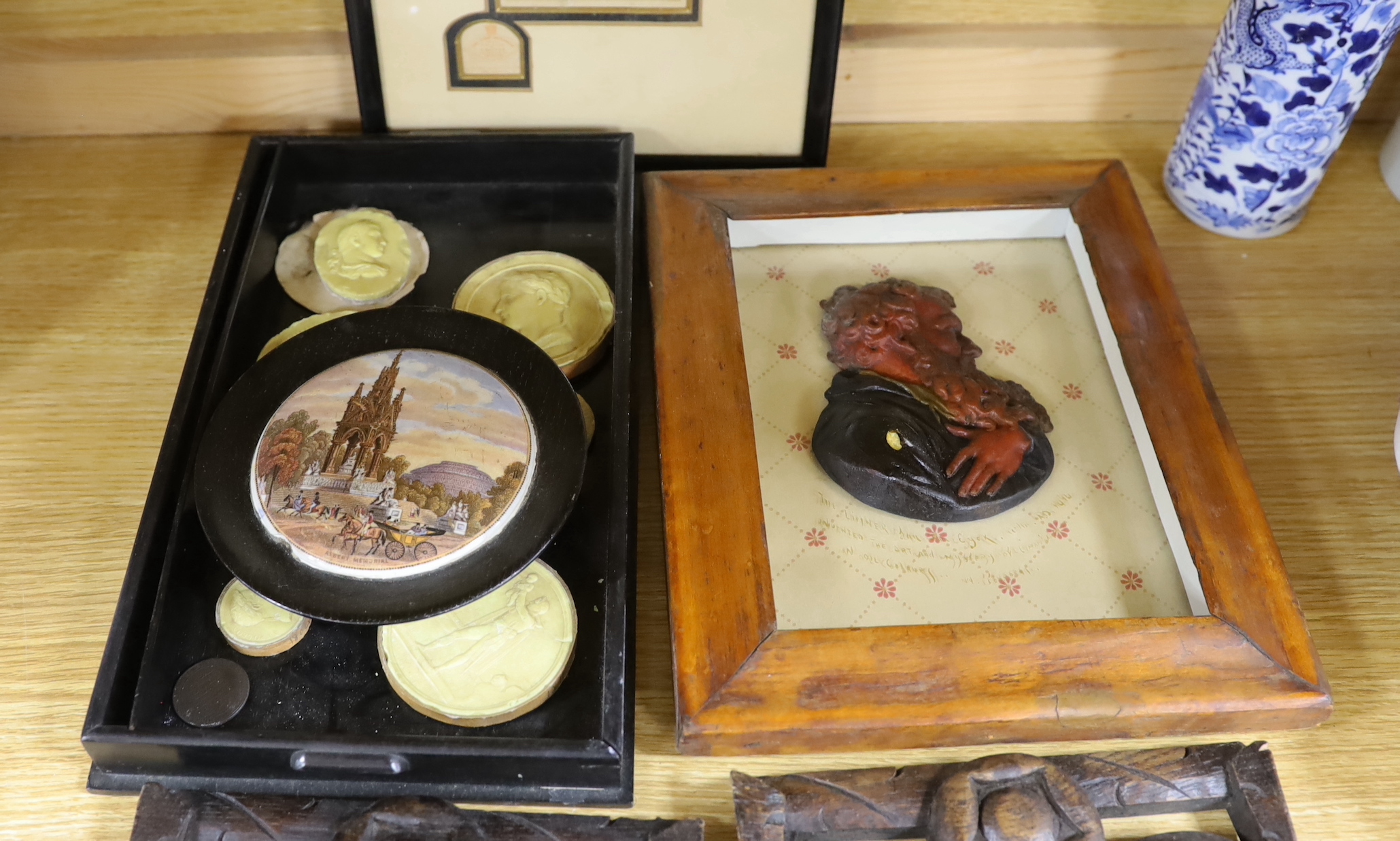 A group of Object d'Art to include Grand tour souvenir plaster roundels, a wax profile portrait, pair of carved oak cornice sections, a moulded plaster frieze etc